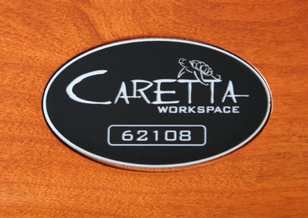 Laser engraved number badge