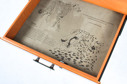 cheetah's engraved in desk drawer